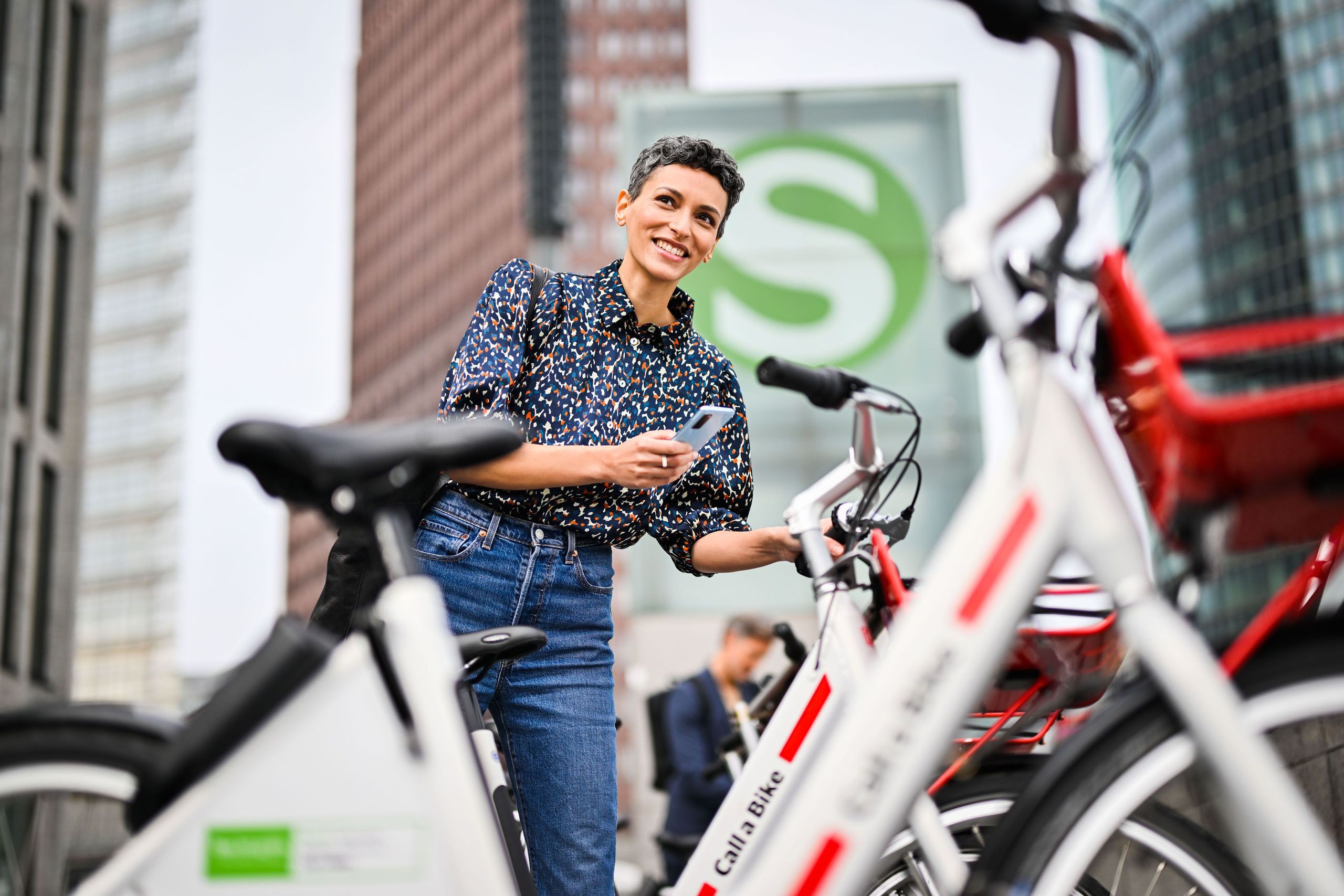 A woman rents a Call a Bike